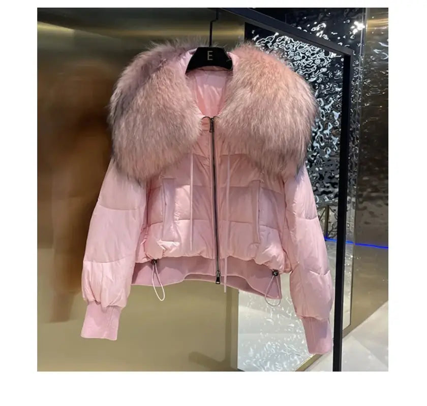Pink puffer jacket with fur collar and ruffle detail for female winter style