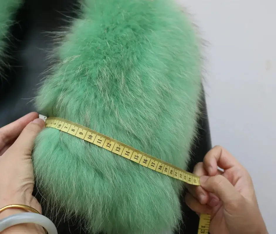 Mint green furry material and yellow tape measure for Female Winter Jacket design