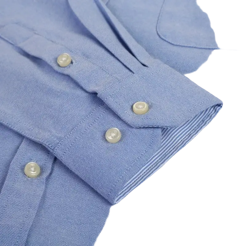 Blue oxford casual shirt with white buttons and striped cuffs