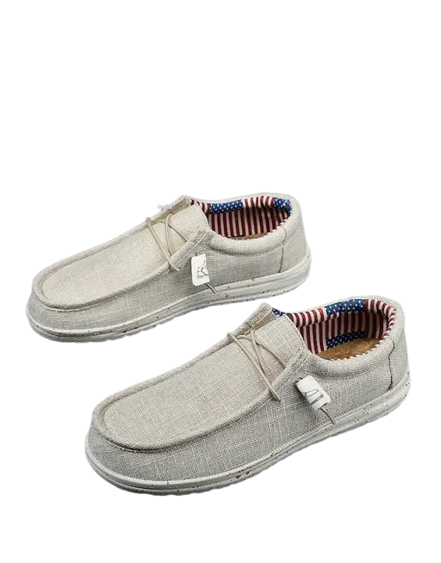 Gray canvas slip-on casual shoes with American flag tag