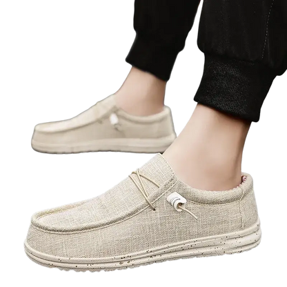Beige canvas slip-on casual shoes with white soles and American flag design