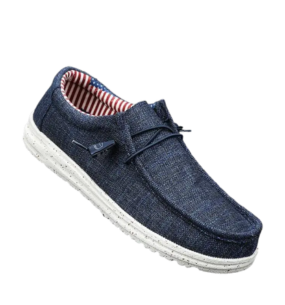 Navy blue casual shoes with white sole, red lining and American flag design