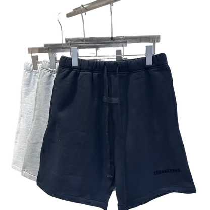 Navy blue drawstring jogger shorts with white hip hop logo