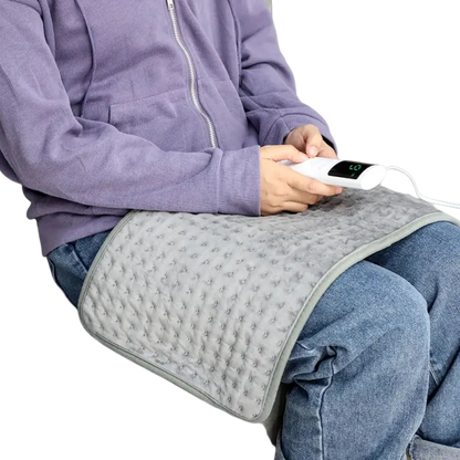 Dark grey electric heating blanket with textured cover and controller for sofa bed