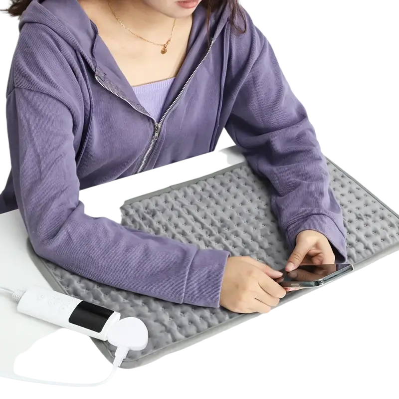 Dark grey electric heating blanket with textured surface and white temperature controller