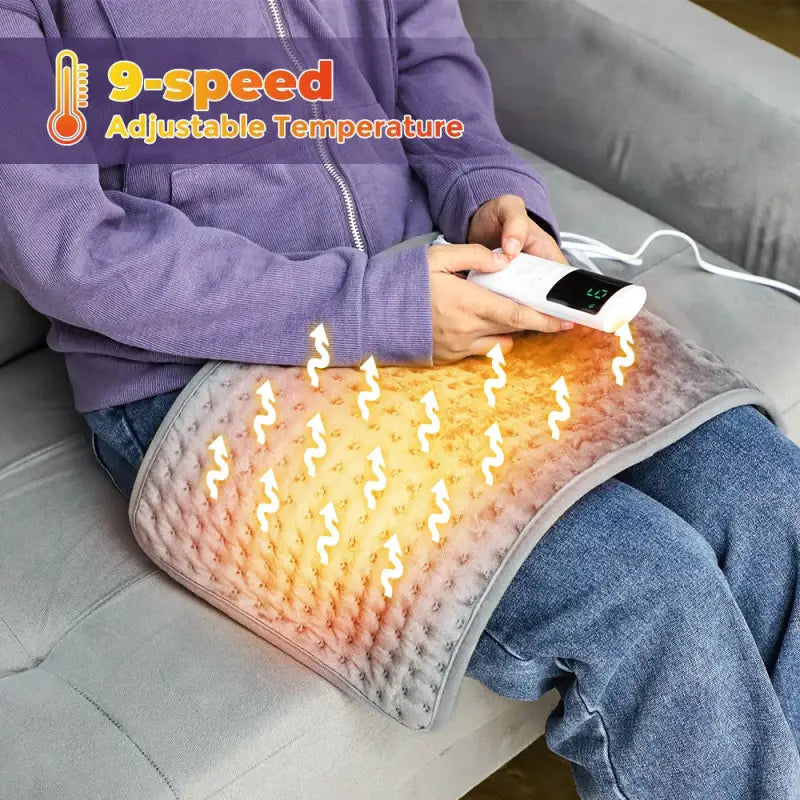 Dark grey electric heating blanket with adjustable temperature and glowing indicators