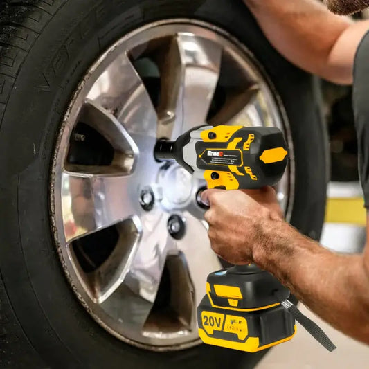 Yellow and black electric impact wrench removes lug nuts from a car wheel effortlessly