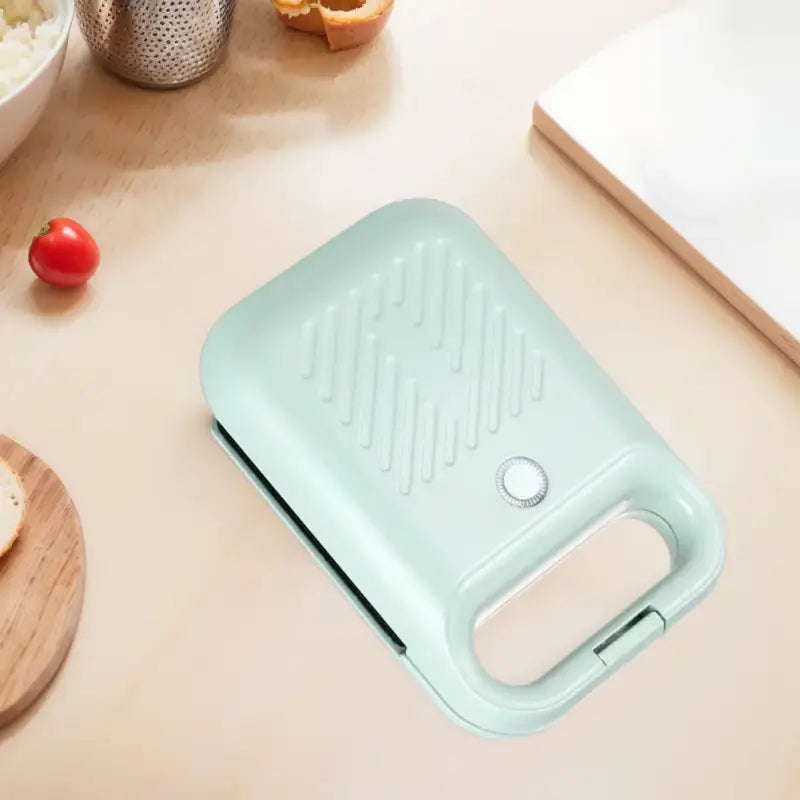 Mint green sandwich maker panini press with non-stick coating for egg omelettes