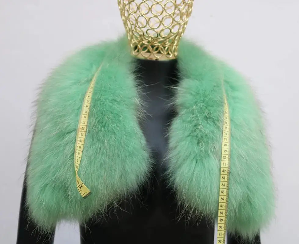 Mint green fluffy fur collar with measuring tape, perfect for a Female Winter Jacket