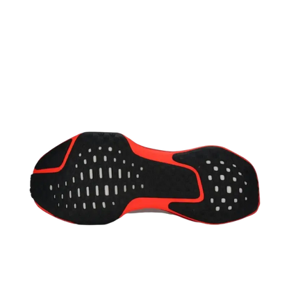 Black and red Nike Air Max running shoes sole with white speckles and cushioned design